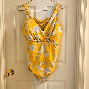 Yellow floral cacique swimsuit with adjustable tie back.